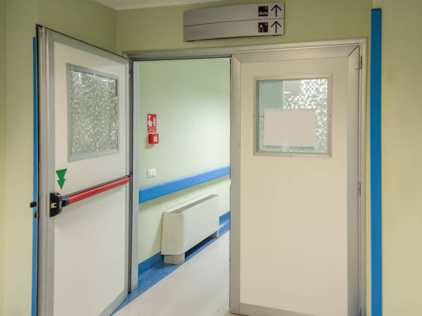 istock Open hospital ward door with red emergency handle 2204341250