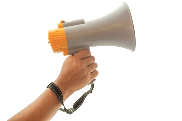 istock Hand holding a megaphone for announcements. 2204342068