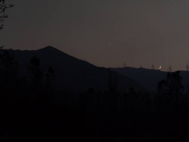 istock Crescent Moon and Star Shining Over a Mountain at Night 2204343041