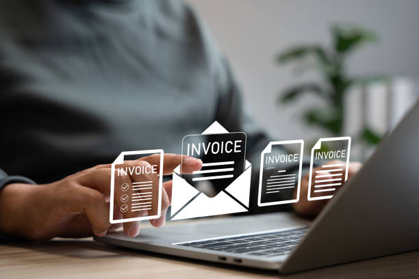 istock E-Invoice and Digital billing concept, Businessman using laptop to manage electronic statements on virtual screen. E-tax, Digital receipt, Online invoice processing and tax accounting solutions. 2204344759
