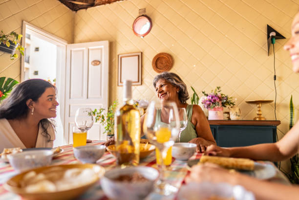 istock Mother talking to daughter during lunch at home 2204347552