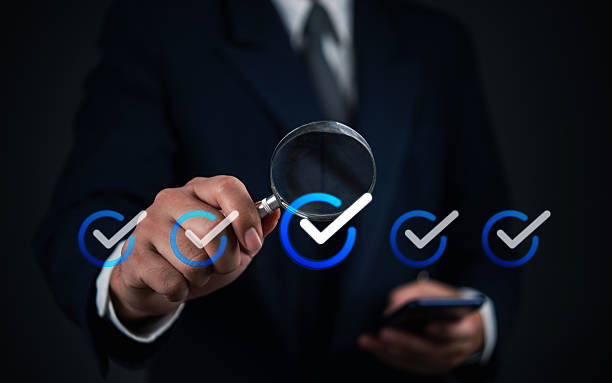 istock Business verification process with checkmarks and a magnifying glass. Focus on technology, analysis, and security in modern business practices. 2204347734
