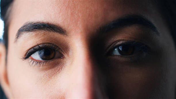 istock Close Up Young Woman's Face With Focus On Her Eyes 2204349855