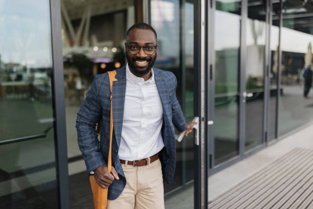 istock Happy traveler leaving airport with joyful expression 2204351255