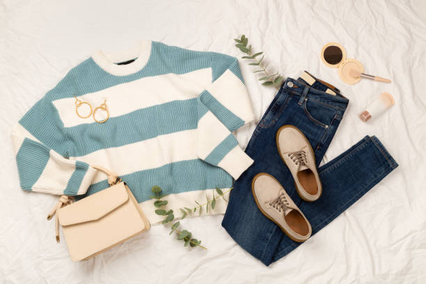 istock Flat lay with women's trendy spring outfit on white sheet background, top view 2204352712