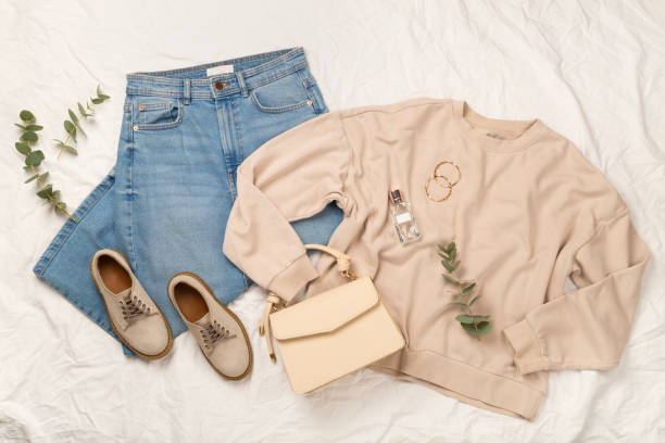 istock Flat lay with women's trendy spring outfit on white sheet background, top view 2204352739