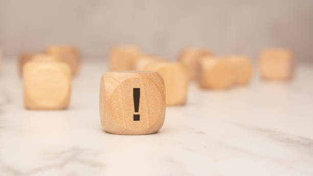 istock wooden block with an exclamation mark symbol, highlighting caution or important information 2204353231