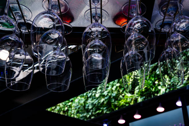 Cocktail glasses hangin above a bar