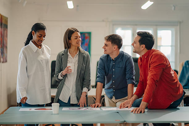 istock Marketing team analyzing charts and discussing during a meeting 2204354099