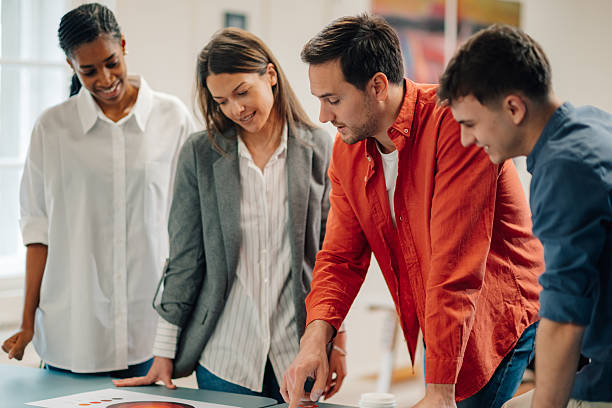 istock Marketing team analyzing pie chart during business meeting 2204354242