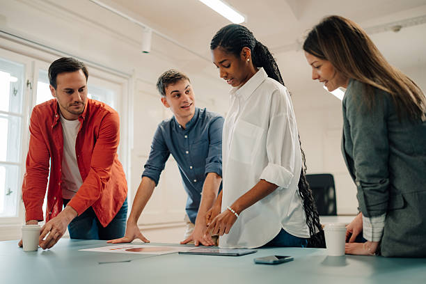 istock Marketing team analyzing charts and digital tablet during meeting 2204354250