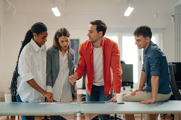 istock Marketing team discussing new project during meeting in office 2204354254