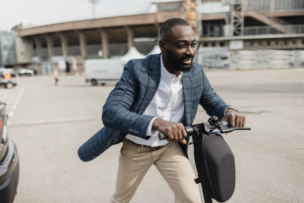 istock Businessman Riding Electric Scooter with Joy 2204354862