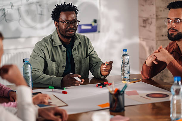 istock Marketing team discussing new project during brainstorming meeting 2204358519