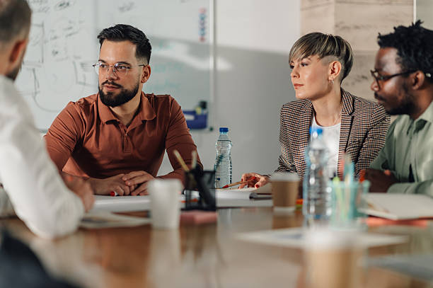 istock Business people collaborating during meeting in modern office 2204358538