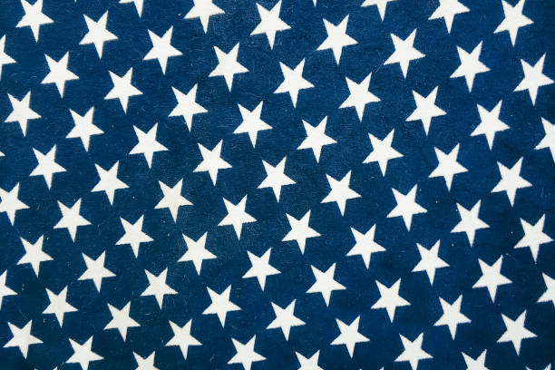 The design features white stars on a dark blue background, symbolizing patriotism, often used in national holiday decorations.