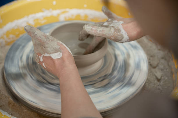 istock Female potter hands close up 2204360834