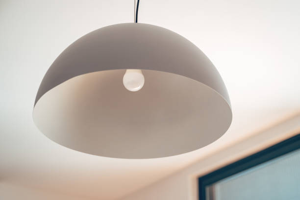 istock Bell shaped pendant light in living room 2204361753
