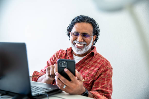 istock Mature Indian Man Working from Home Office at Laptop 2204363094
