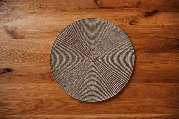 istock Round table mat or placemat on oakwood table 2204363953