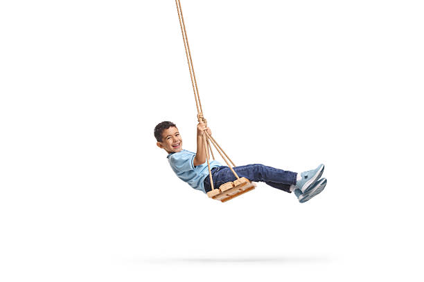 istock Happy boy swinging on a swing 2204373982
