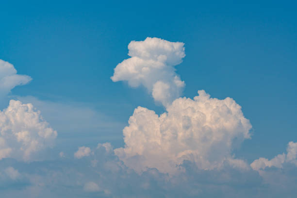 One beautiful big cloud on blue sky. White fluffy clouds in sky for background.