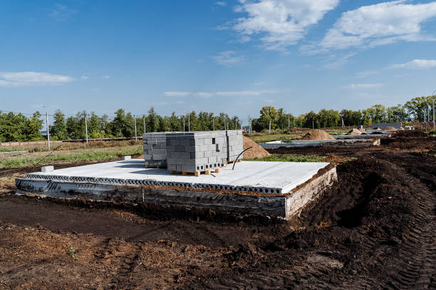 istock Currently, a strong foundation for a house is being constructed in a dirt field 2204375667