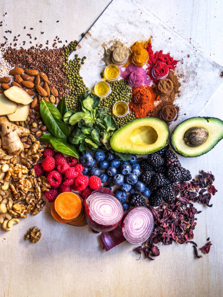 istock Multi colored vegetables, fruits, legumes and spices on wooden table 2204377021