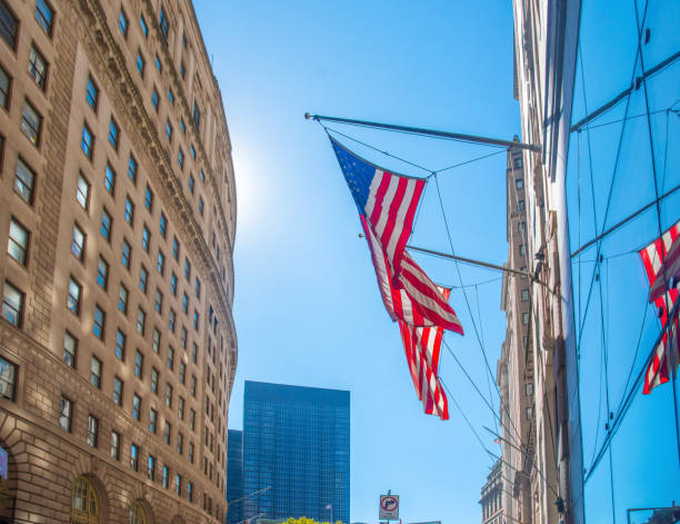 istock US flag under a shining sun in Lower Mahattan 2204378589