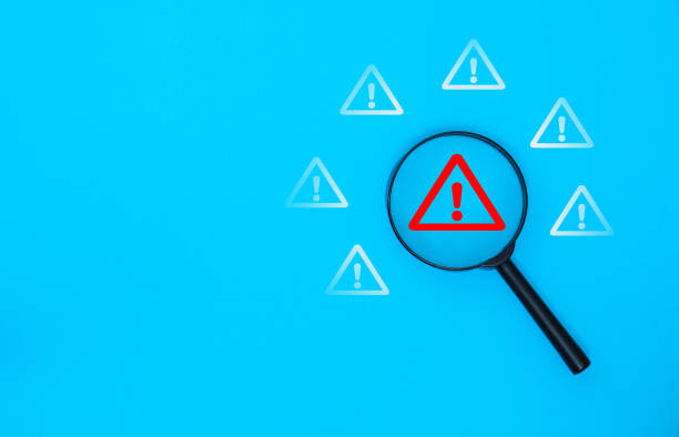 istock Magnifier focus on warning alert alarm 2204381474