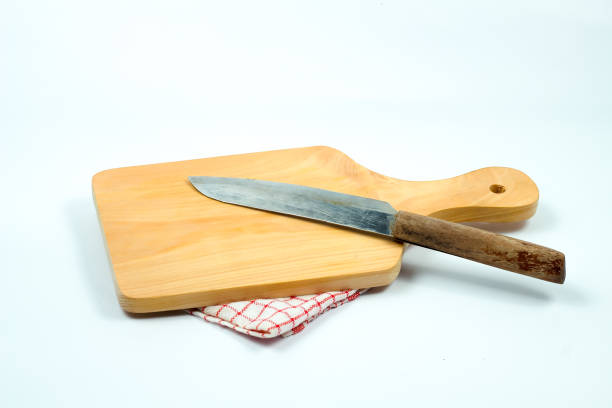wooden board and old knife isolated on white background