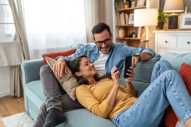 istock Young couple relaxing at home 2204387104