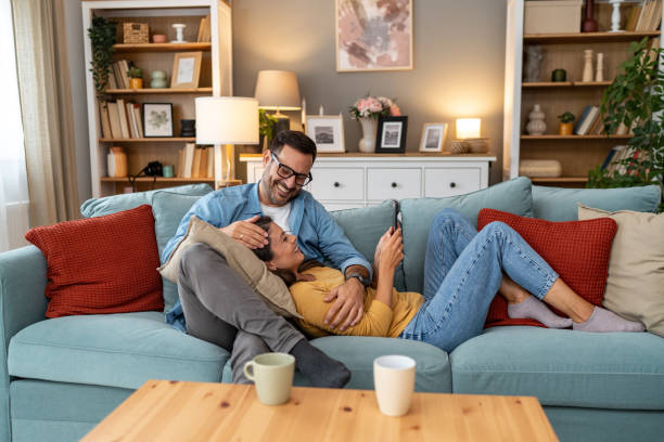 istock Young couple relaxing at home 2204387125