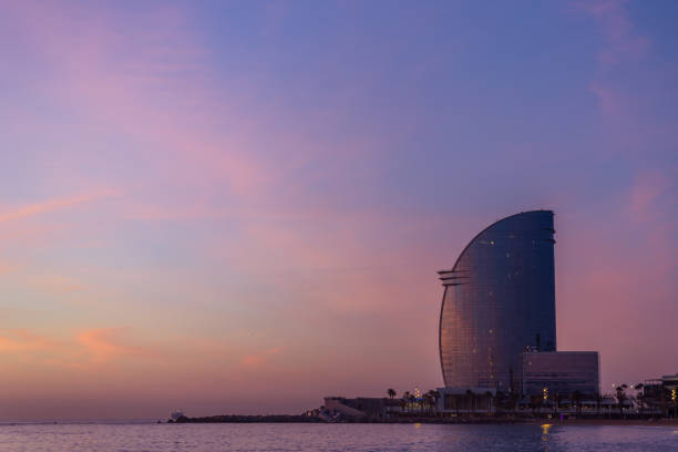 istock Modern hotel at sunset by the sea 2204387384