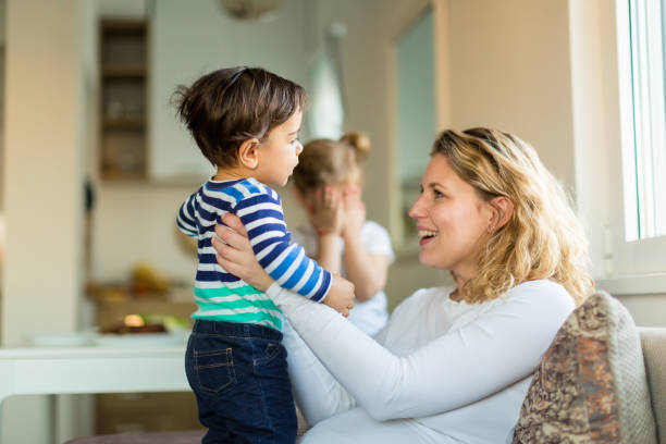 istock Happy Mom with Children at Home 2204387864