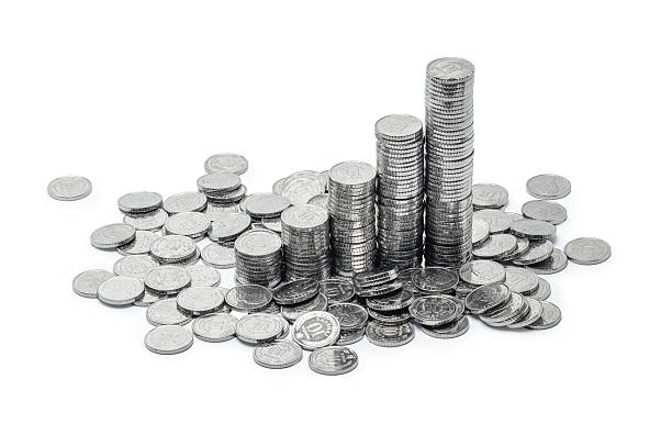 istock Stacks of silver coins on a white background 2204390113