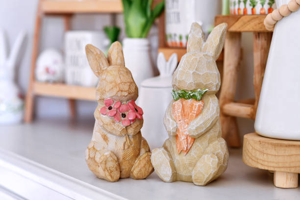 3D rendered, one blue easter bunny and yellow color easter bunnies. Easter concept background with copy space.