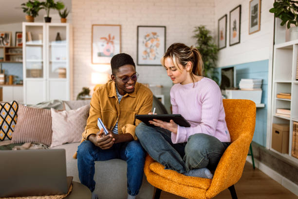 istock Group of students studying together at college dorm room. 2204393151