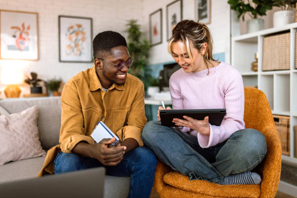 istock Group of students studying together at college dorm room. 2204393173