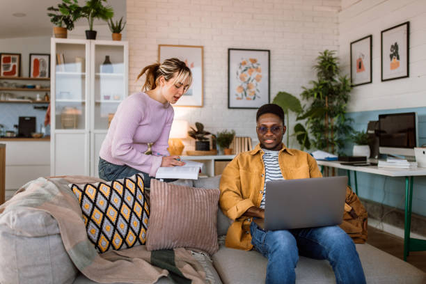 istock Young man and woman studying together 2204393252