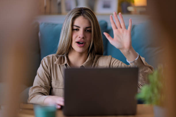 istock Young Woman working on laptop at home 2204394420