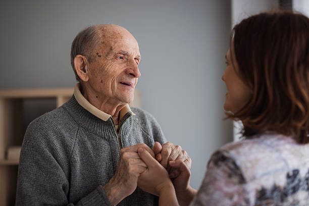 istock Loving elderly man holding his daughter by the hands 2204395150
