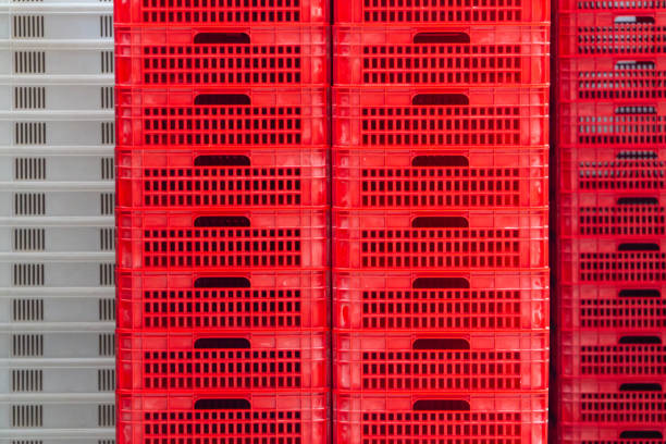Red and white professional boxes for merchandise stored on a factory warehouse