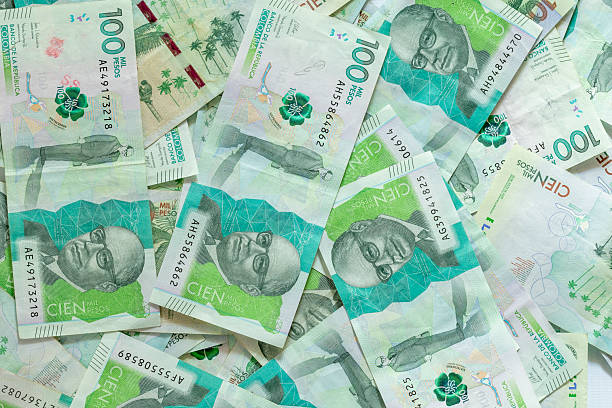 istock Colombian paper money, seen from above 2204395790