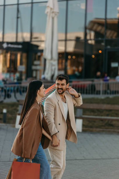 istock Elegant couple shopping 2204395810