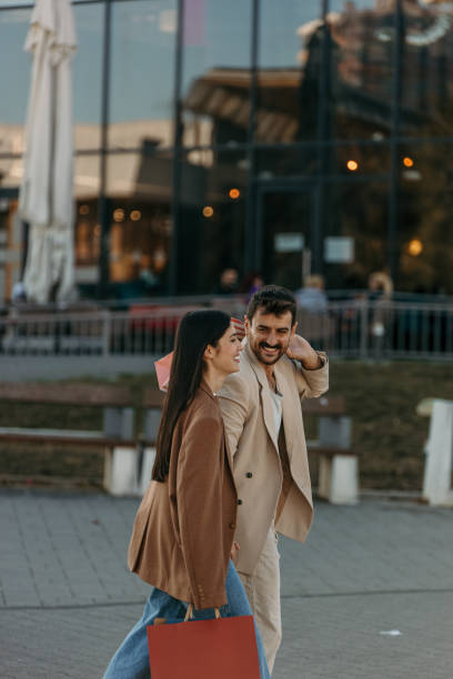 istock Elegant couple shopping 2204395817