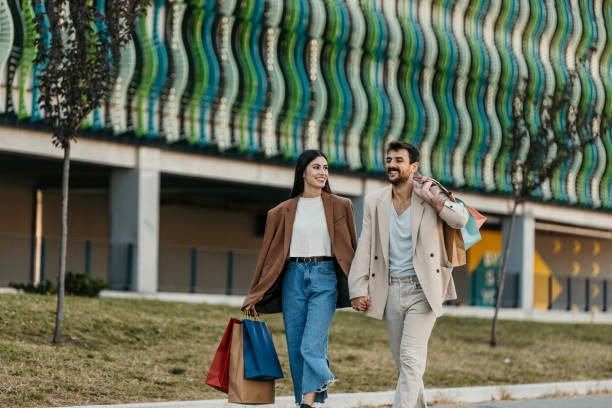 istock Couple in front of the shopping mall 2204396821