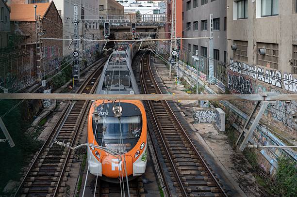 Athens, Greece - December 19, 2023: Metro passes tunnel along the ancient Greek Agora with National Observatory and Saint Marina Church in background