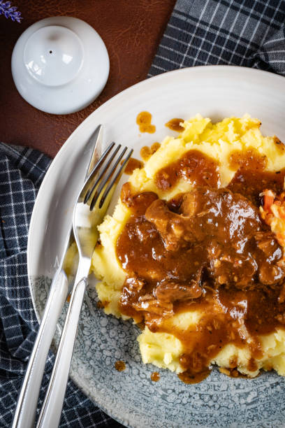 istock Stewed pork neck in sauce. 2204405197