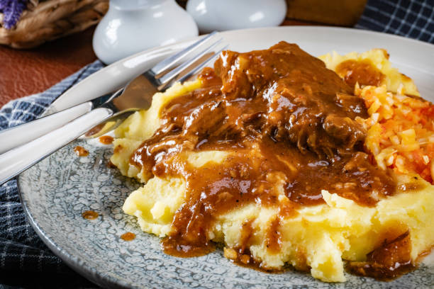 istock Stewed pork neck in sauce. 2204405229